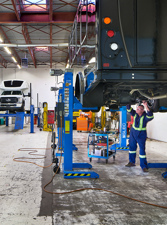 Dynamic Specialty inside repair facility working on passenger van